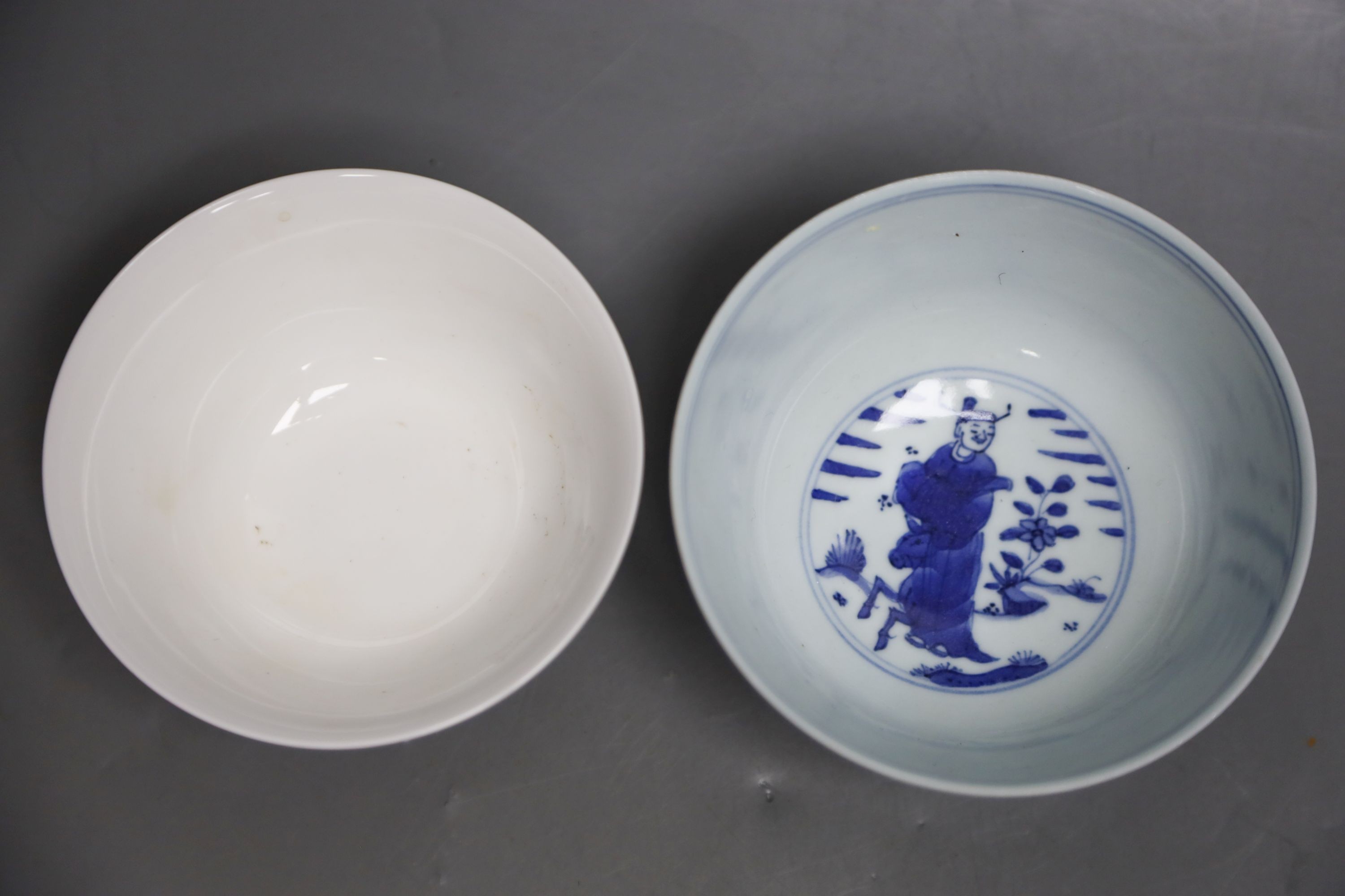 A Chinese blue and white figural bowl and another prunus decorated bowl, 11cm